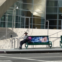 a man waiting in front of WDMH